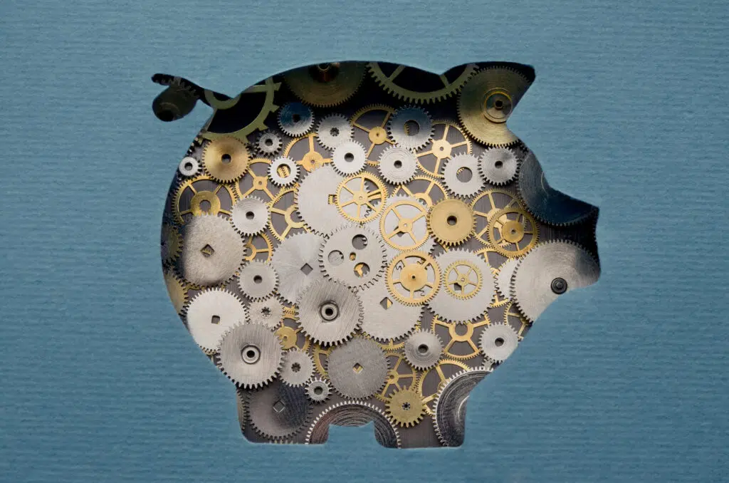 A pig made up of cogs and wheels depicting how traction helps to raise funding for startup